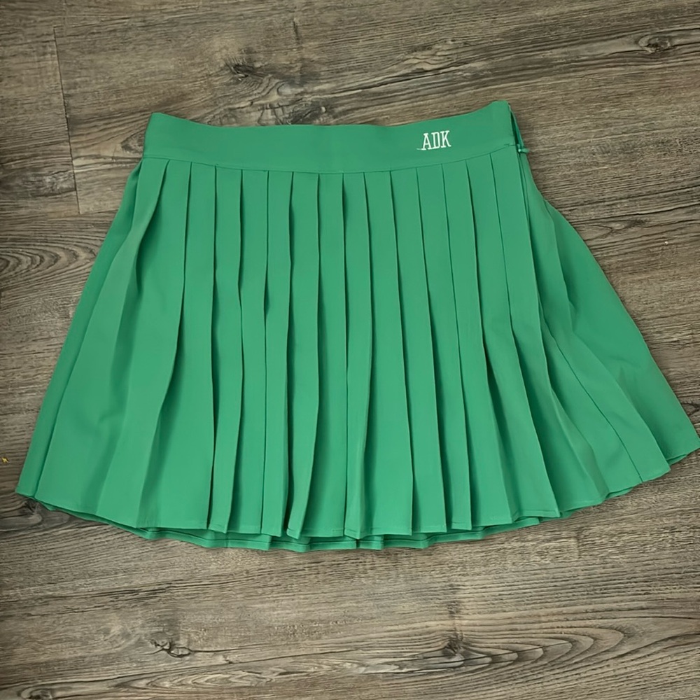 New green pleated skirt